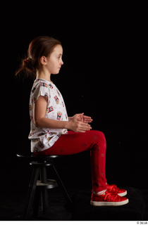 Lilly  1 dressed red leggings red shoes sitting t…